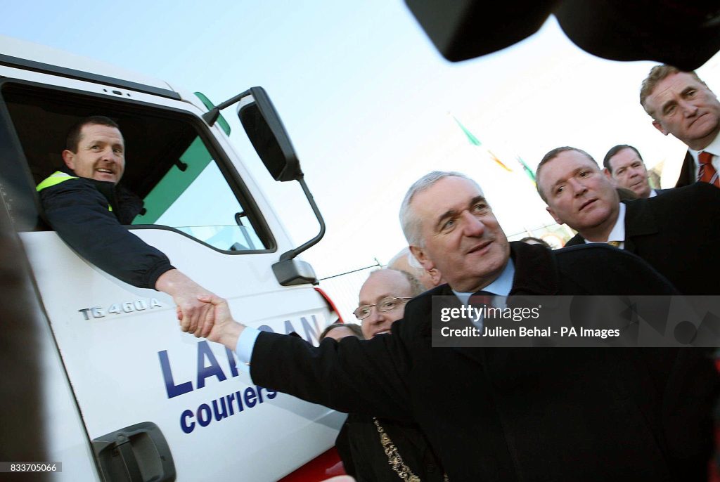 John McGann, director of Langan Couriers, Galway driving the first truck through Dublin City's Port Tunnel shaking hands with Taoiseach Bertie Ahern, at the opening of the new tunnel.   (Photo by Julien Behal)